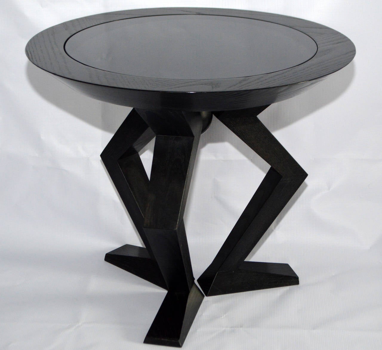 This fabulous Brueton Geppetto Table inspired by early African designs, features uniquely shaped and tapered solid ash legs. These stylized tables have a mind and personality of their own.
Brueton Geppetto Table by Stanley Jay Friedman. Black wood,