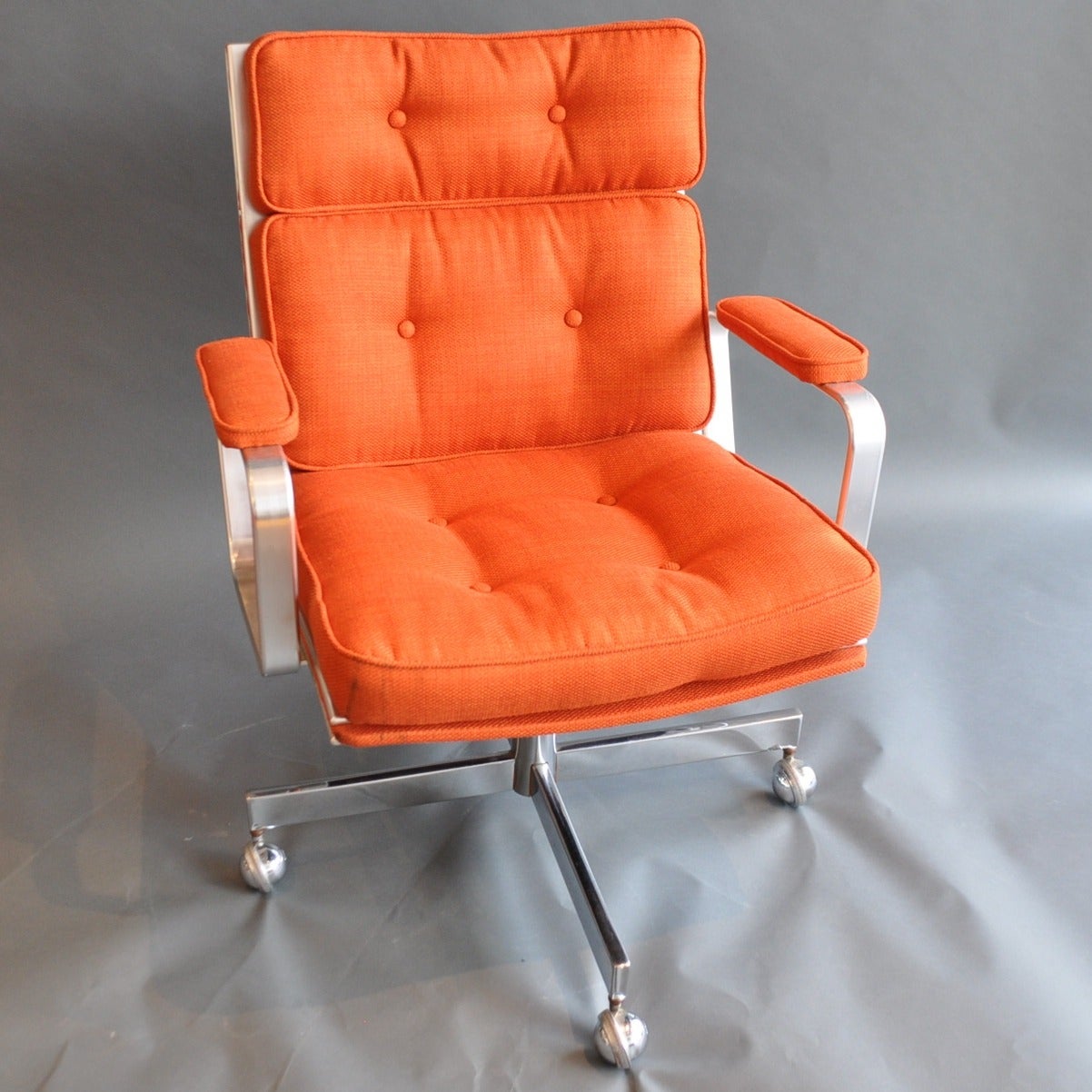 This 1970’s chair produced Jos Design in Sweden was designed by the famed Karl-Erik Ekselius.The fabulous piece has been reupholstered in a fantastic orange linen and the brushed aluminum frame is like new.