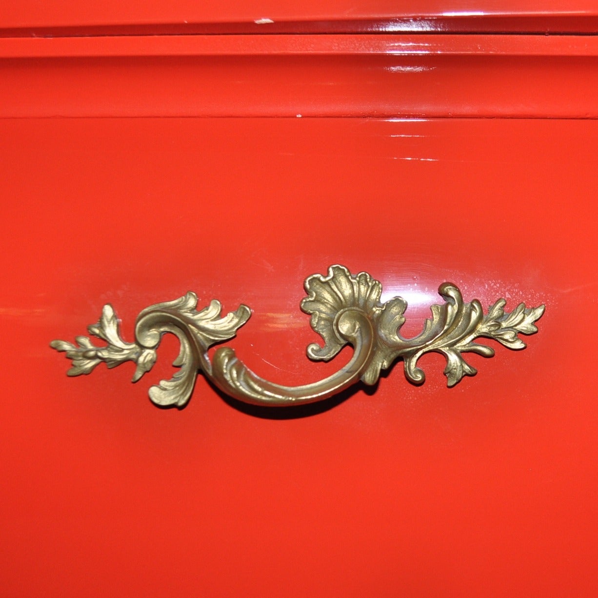This traditional Bombe chest has been lacquered in a high gloss Million Dollar Red. As a fierce accent piece, the traditional styling of the dresser makes it appropriate for a transitional or contemporary home mixing design aesthetics.