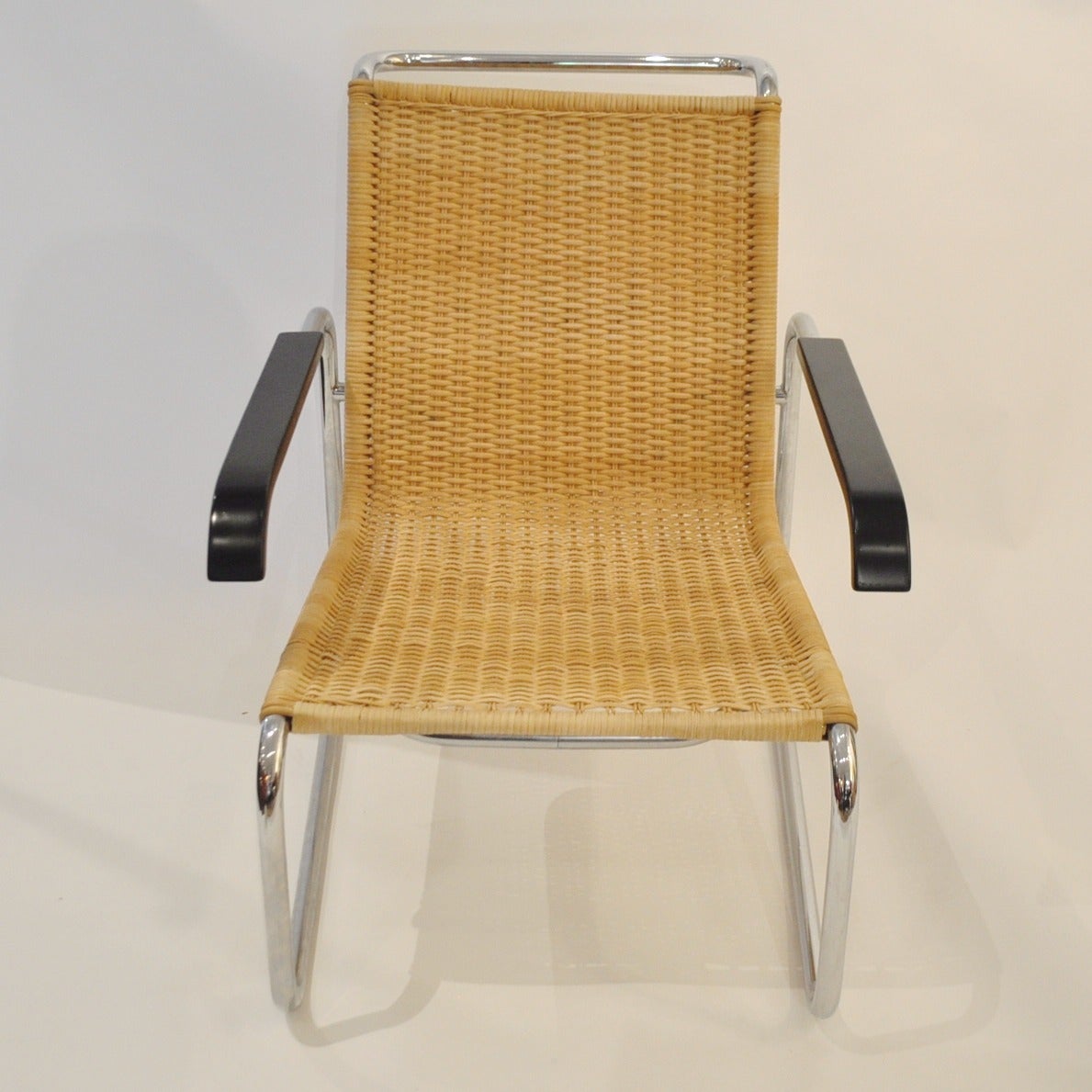These chairs were originally designed in 1928/29 by German designer Marcel Breuer. This pair is made by Thonet in the 1960s and features a continuous tube of chrome plated steel that forms the seat, backrest and armrests of the chair. The separate