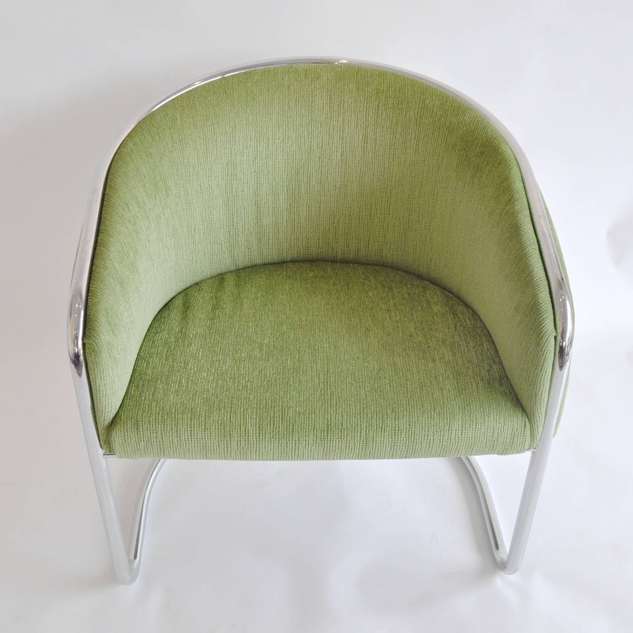 Newly recovered in a green chenille fabric this Milo Baughman-style chair is a  classic addition to any mid-century modern inspired room.