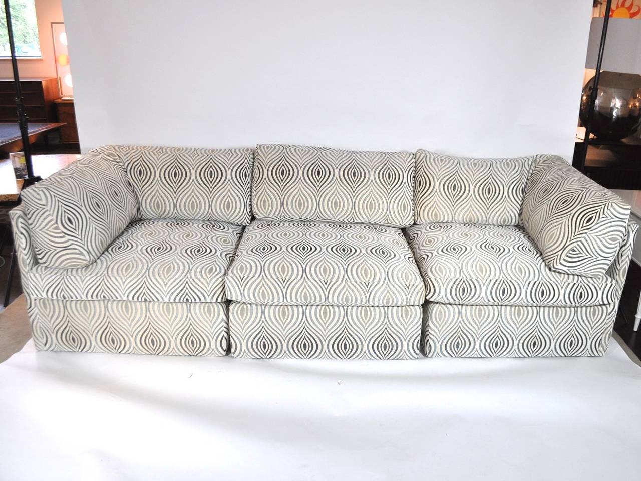 This whimsical sectional by Milo Baughman has the comfort of a modern sofa matched with the purposeful design aesthetic of the mid-century. The pieces separate for versitle seating. The 