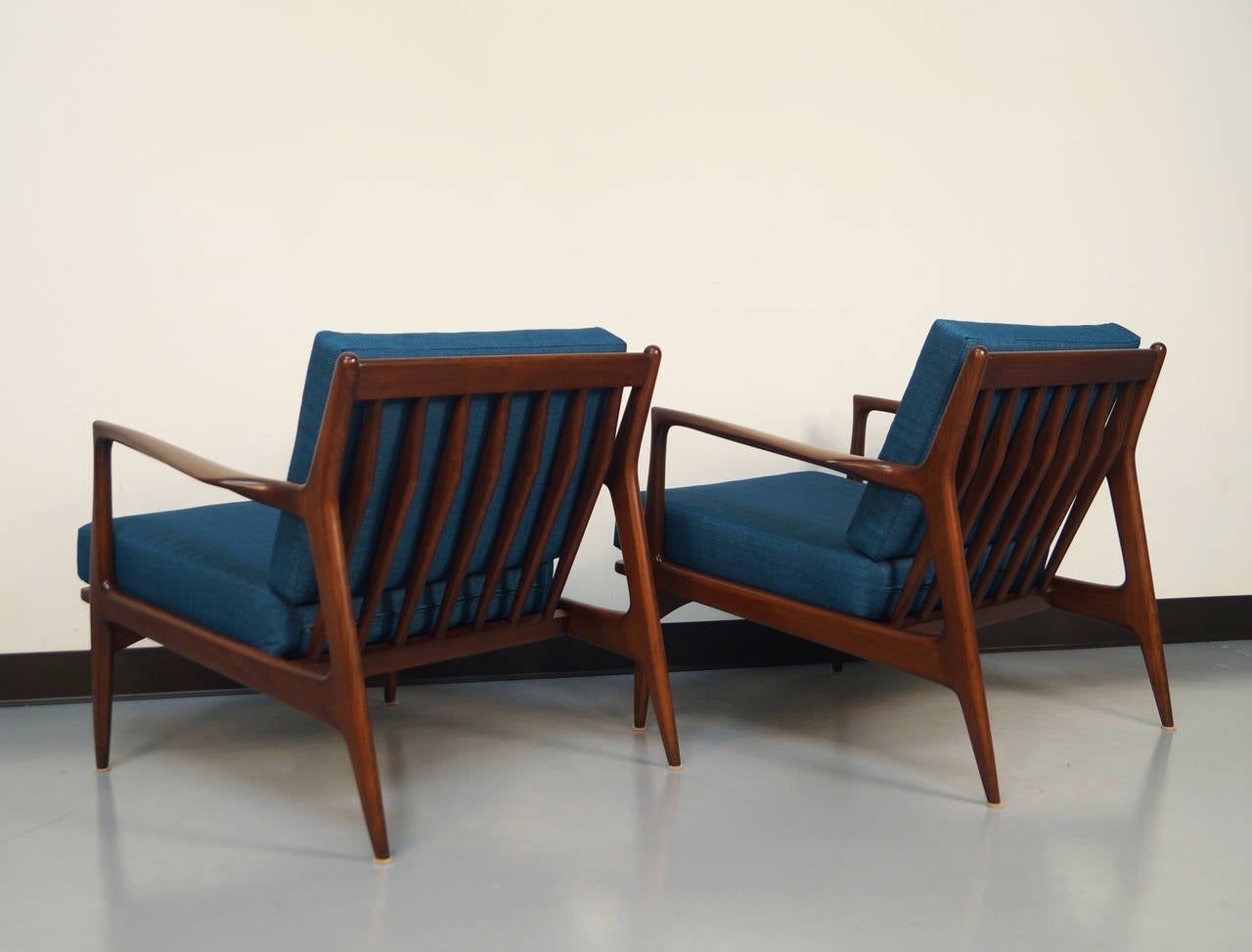 Pair of Danish walnut lounge chairs designed by Ib Kofod-Larsen.