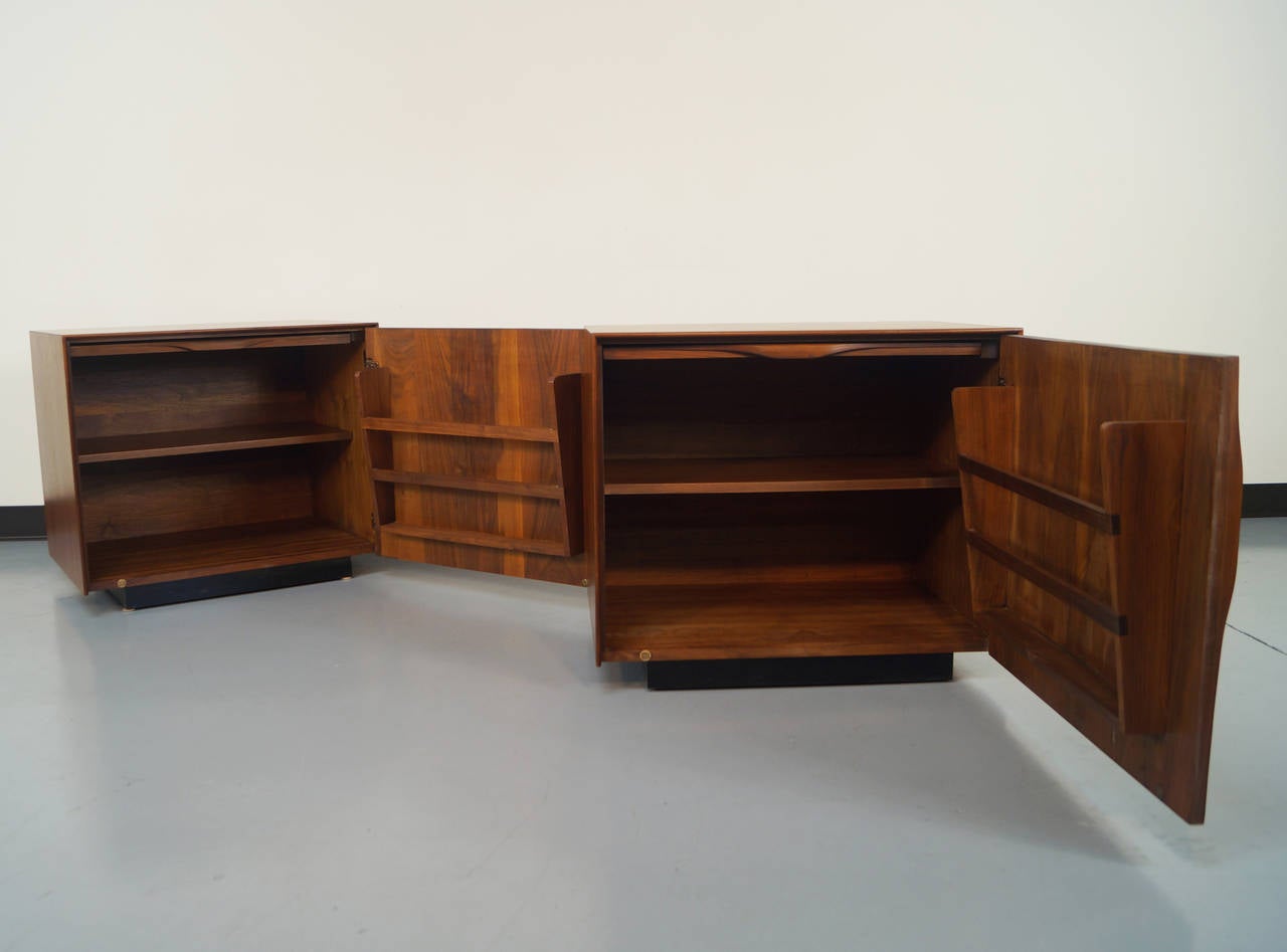 Pair of John Kapel for Glenn of California nightstands or end tables, circa 1960s. The interior has built in magazine holders and pullout trays.