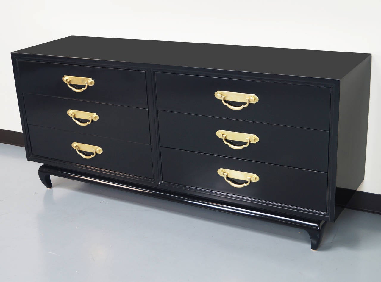 Stunning polished black lacquer dresser with solid brass hardware.