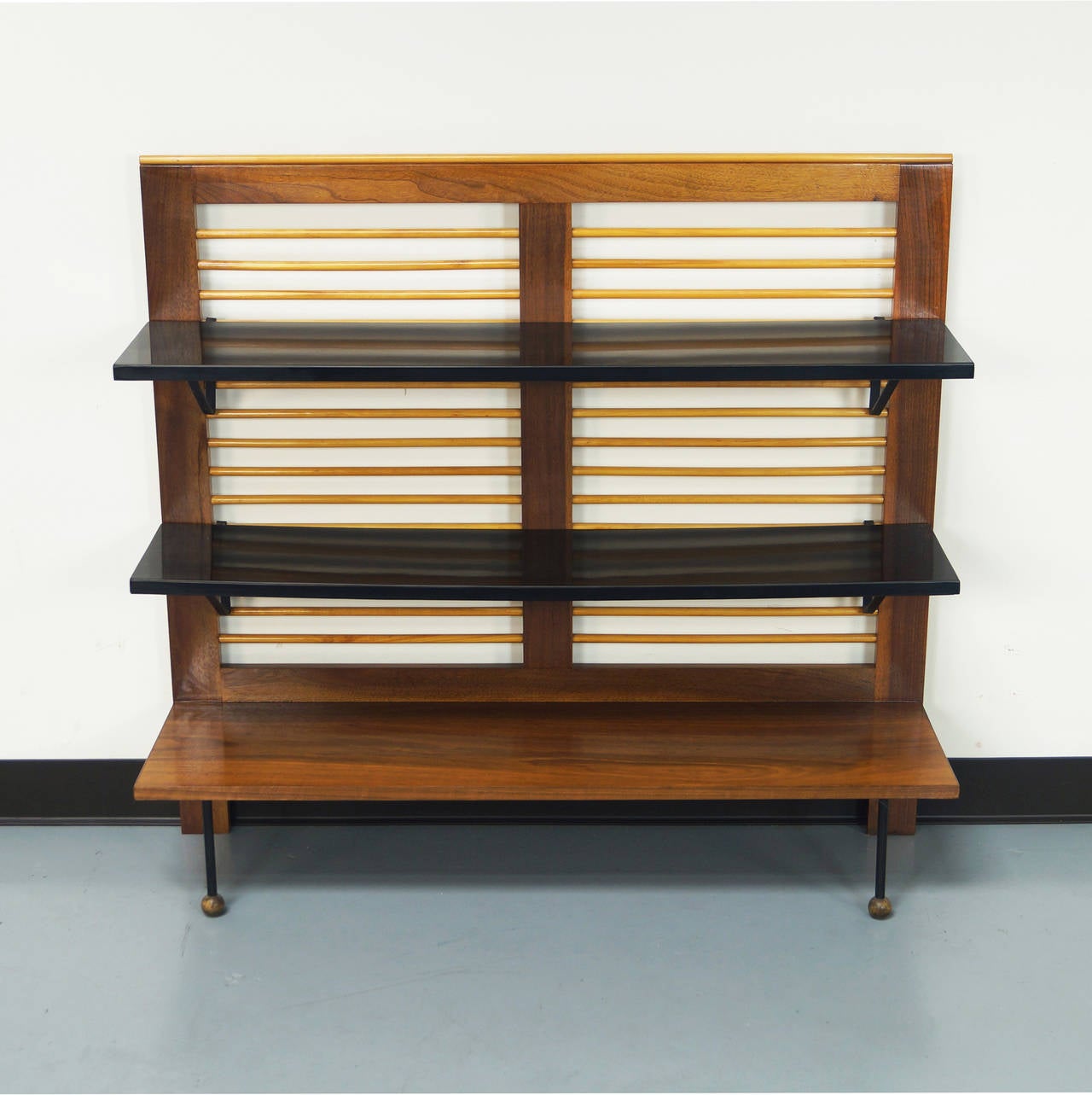 This rare vintage bookshelf / room divider was designed by Greta M. Grossman for Glenn of California. Original finish.

A similar example was being exhibited in 