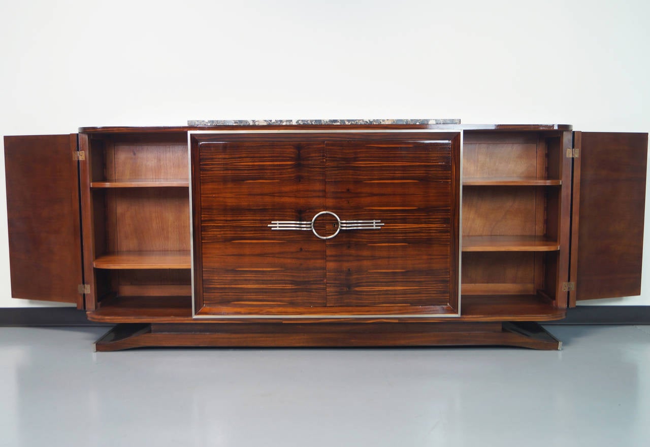 Exceptional French Art Deco Sideboard in macassar ebony and marble top. Professionally refinished.