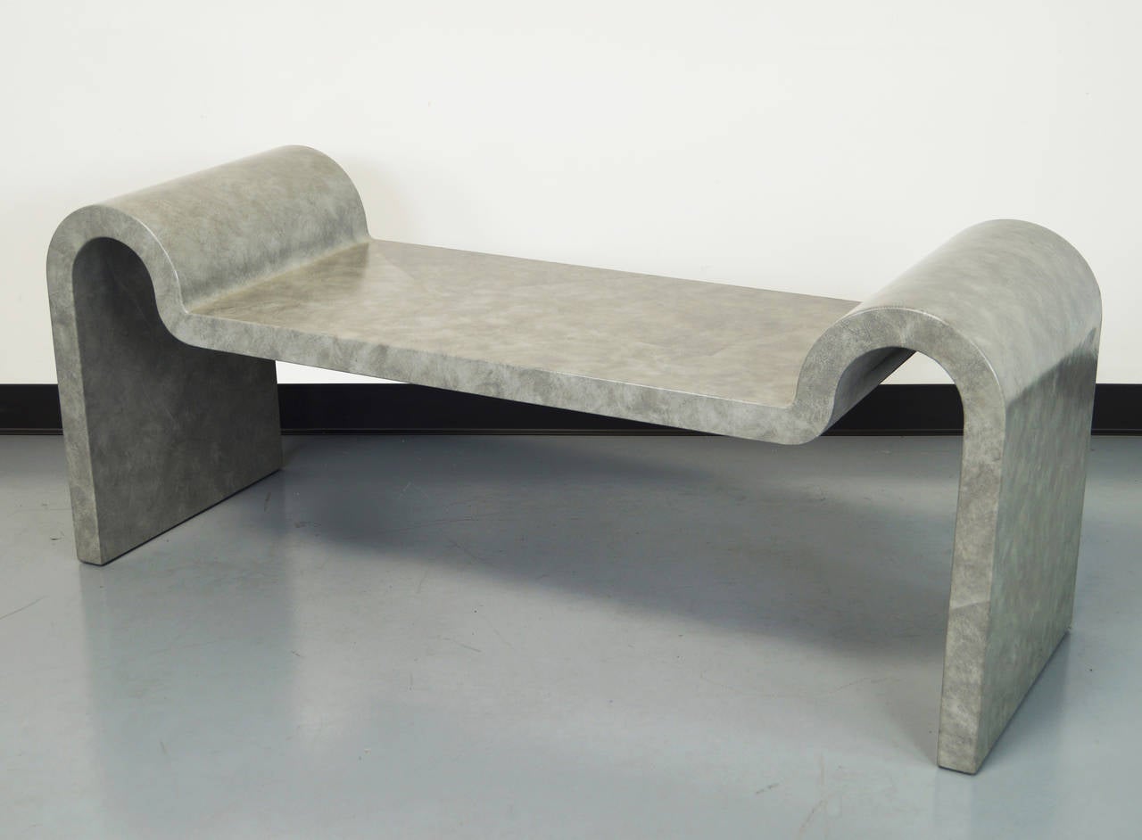 An extremely rare and stunning bench by iconic American designer Karl Springer. This exceptional leather bench exposes beautiful architectural curved legs. The bench is signed and dated.