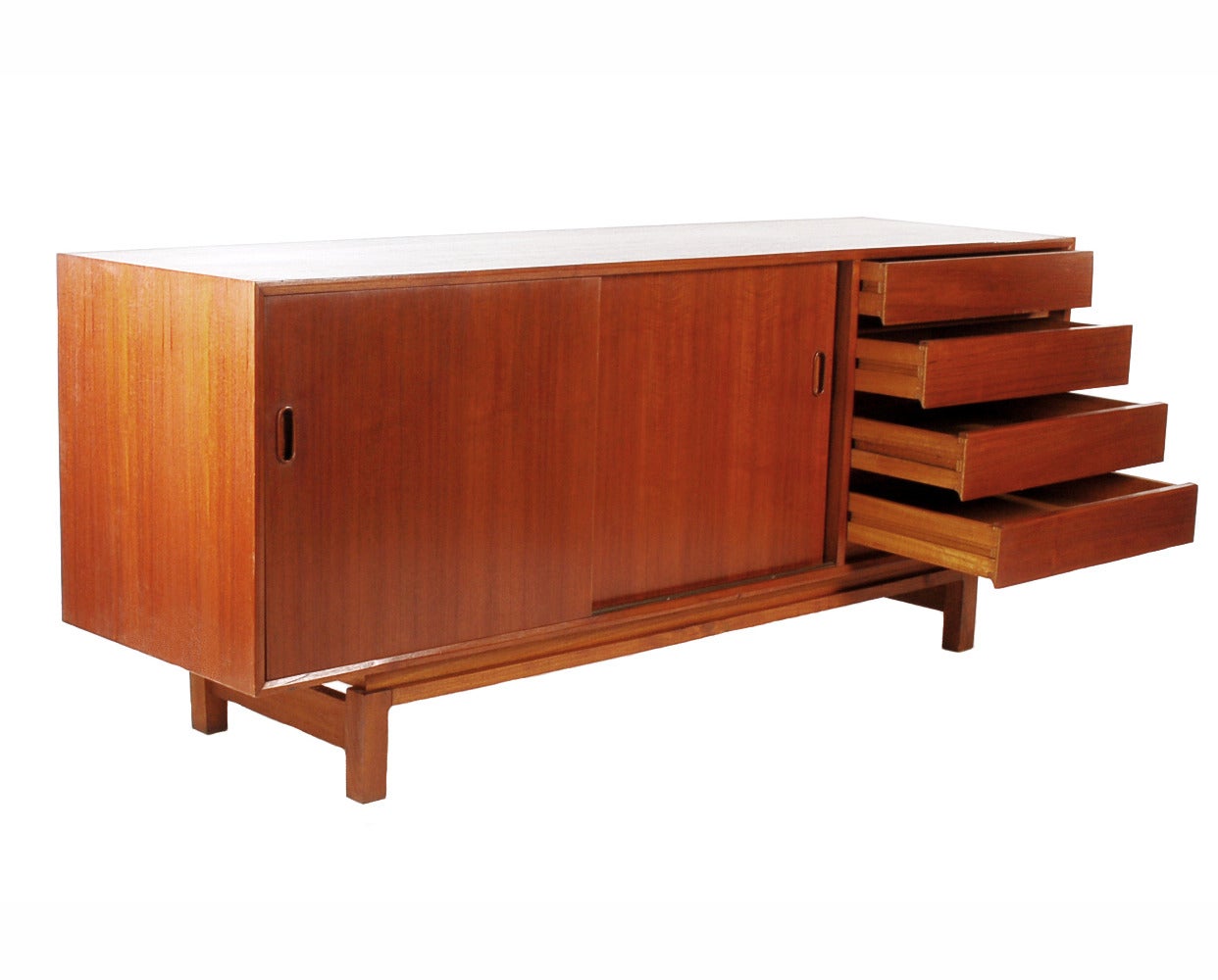 A beautifully constructed teak sideboard circa 1960s. Very clean design lines and provides lots of interior storage.

In the style of: Kai Kristensen or Neils Moller.