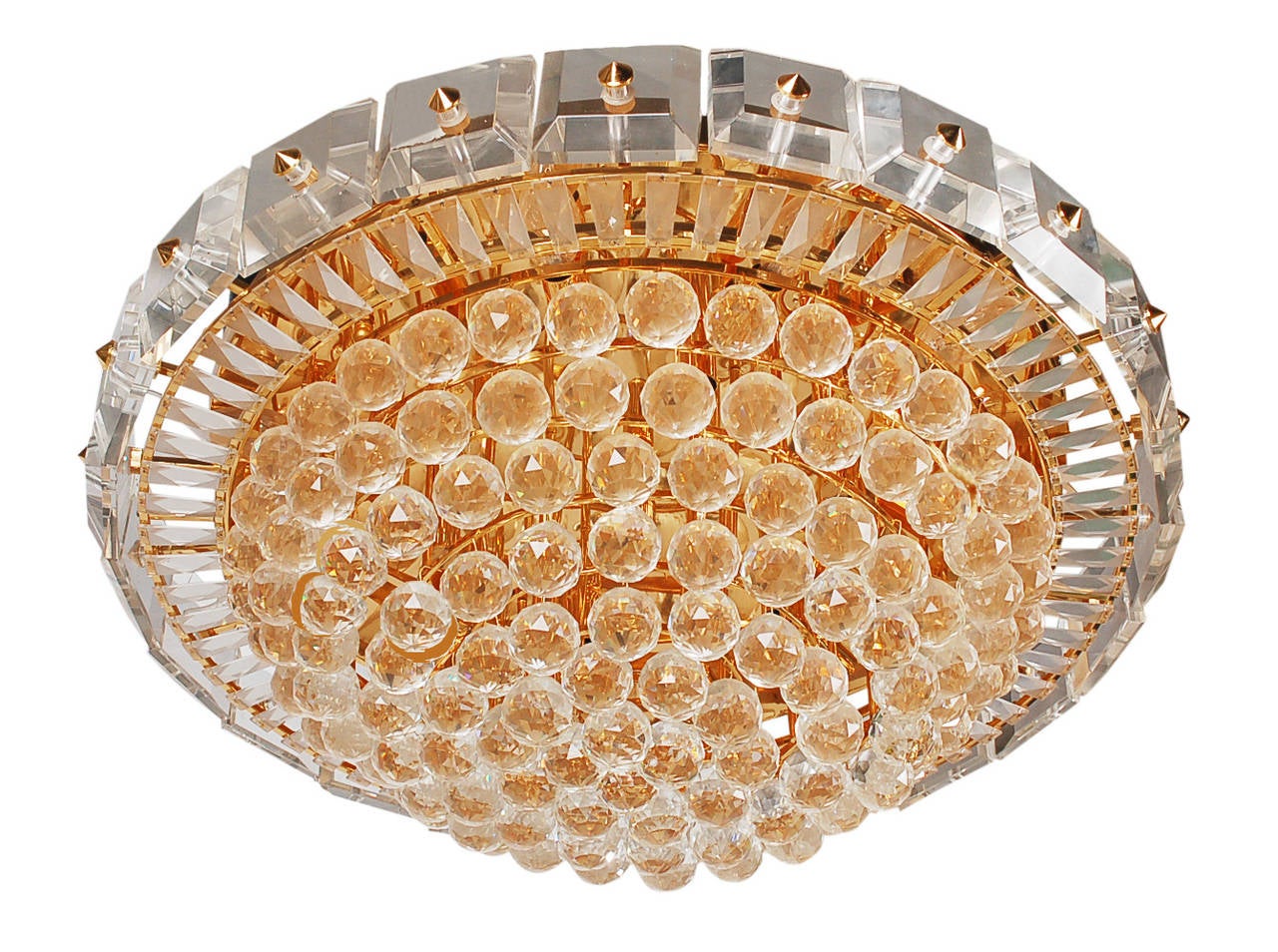 Large flush mount fixture embellished with crystals of three different shapes. The fixture takes 19 candelabra bulbs up to 40W each. Wired and in working condition.