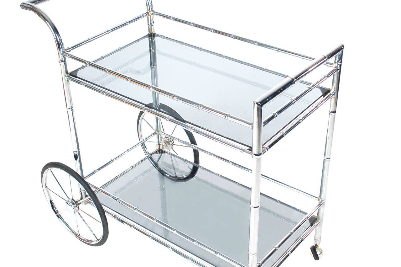 This cart has a great modern twist on a traditional item. It features faux bamboo chrome framing, with slate glass inserts.