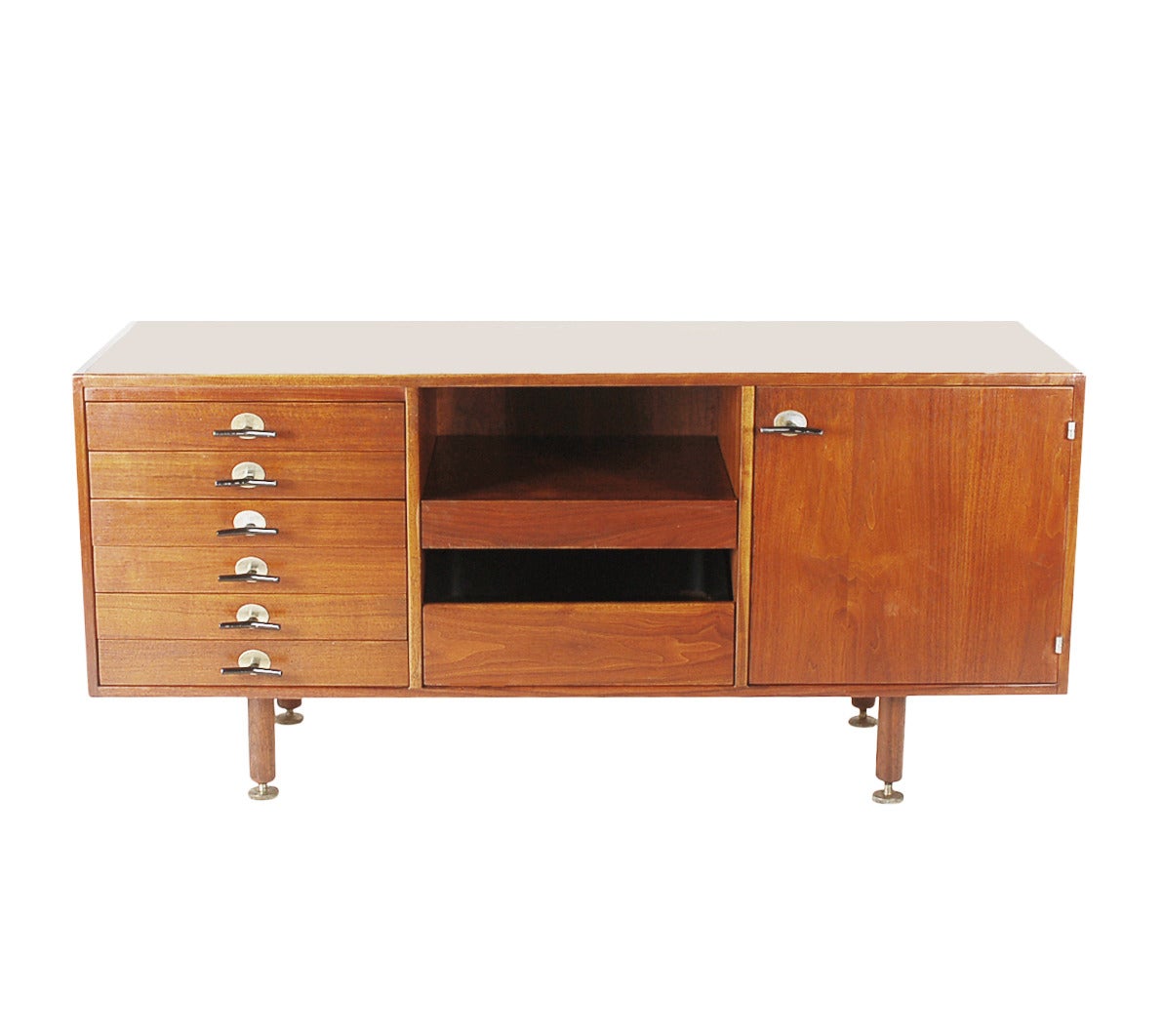 An extremely hard to find cabinet designed by Jens Risom. This unique configuration provides plenty of storage. Gorgeous walnut wood with black signature Y pulls.