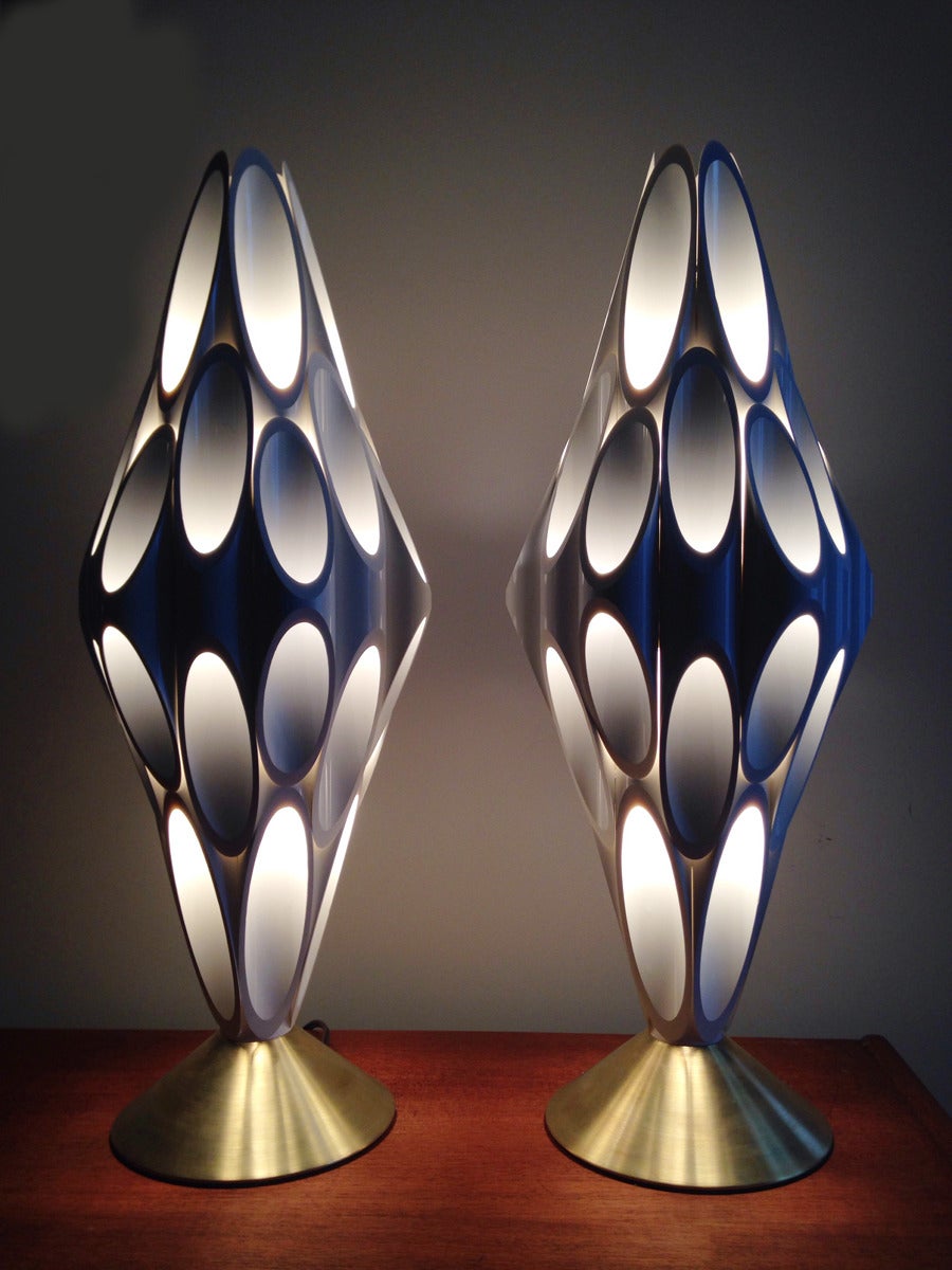 Incredible patching pair of gel coated PVC lamps. The sculptural formation looks incredible when lit. Each takes one standard bulb. Bases are cone shaped brass.