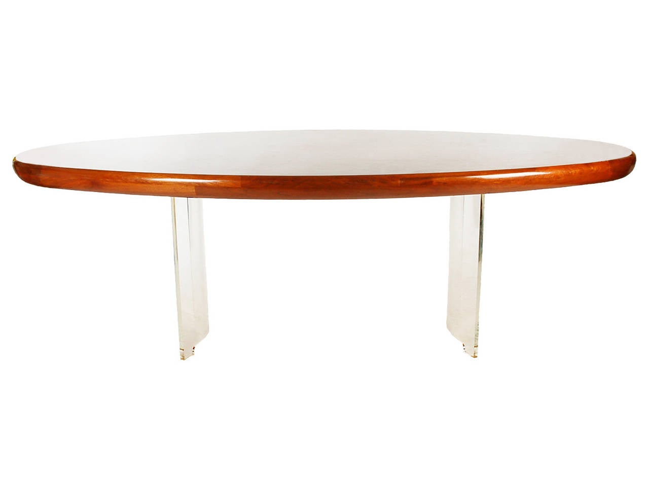 Impressive, and thick floating burl wood top dining table on curved Lucite legs designed by Vladimir Kagan. This was custom ordered in the early 1970s and is in excellent condition, showing light signs of use.