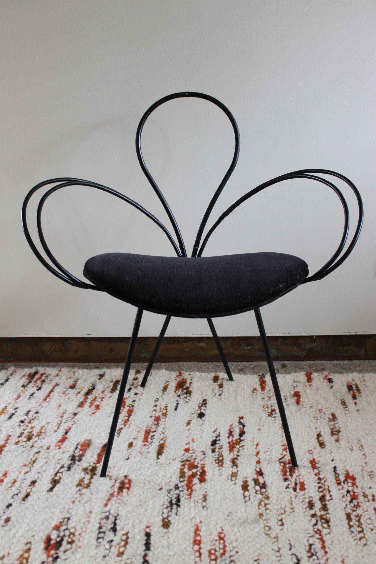 Pair of lovely fully restored Clover Leaf chairs designed by Arthur Umanoff for Shaver Howard.  Iron has been sanded and re-painted.  Seats have been covered in a durable black cotton.