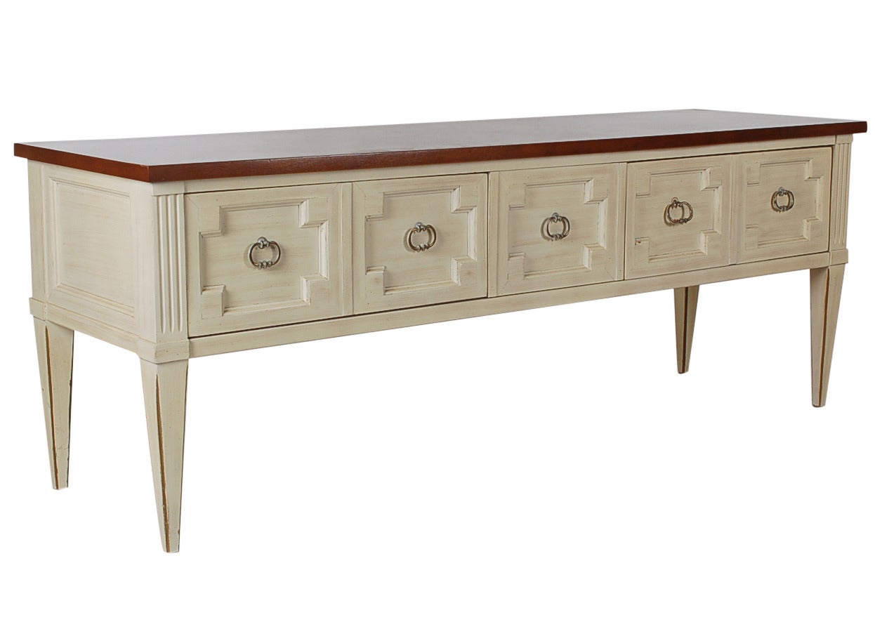 A modern and glamorous white washed wood top console.  A very low sitting and versatile piece. It has two wide drawers on either side and the middle pull is a dummy.