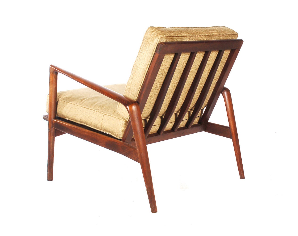 A very nice Scandinavian influenced lounge chair circa 1960's. It features solid walnut frame with gold fabric cushions. Marked: Made in Italy