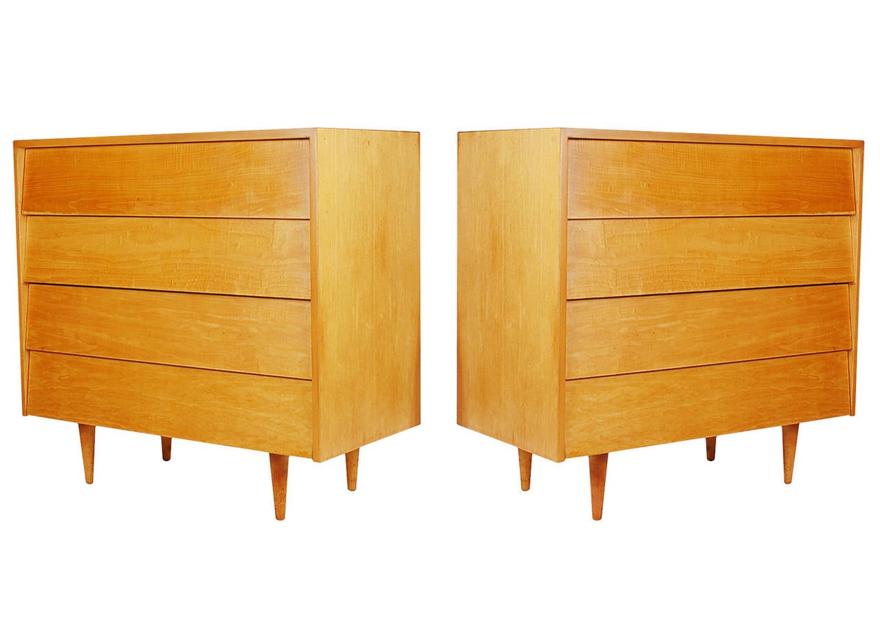 A pair of four-drawer dressers designed by Florence Knoll and produced by Knoll Associates, circa 1958. Constructed of beautiful maple with white laminate tops.