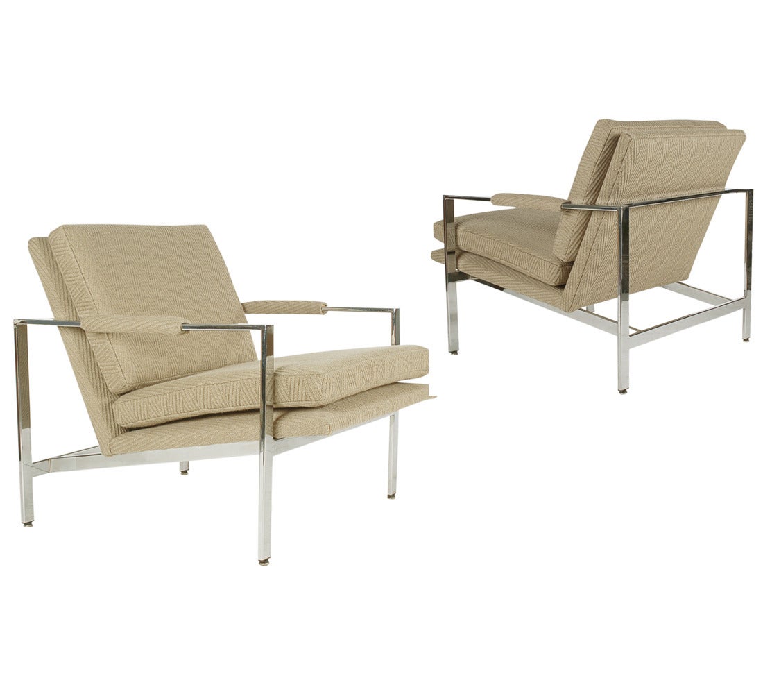A matching pair of lounge chairs designed by Milo Baughman and produced by Thayer Coggin. They feature chrome flat bar frames and wool upholstery.
