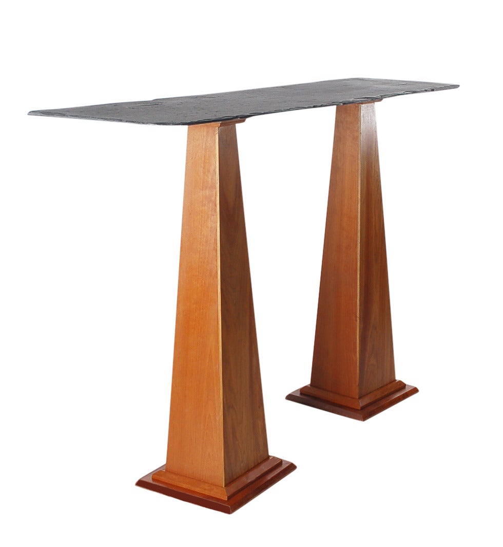 A custom-made studio console table, circa 1980s. It features a natural cherry base with live edge slate top.