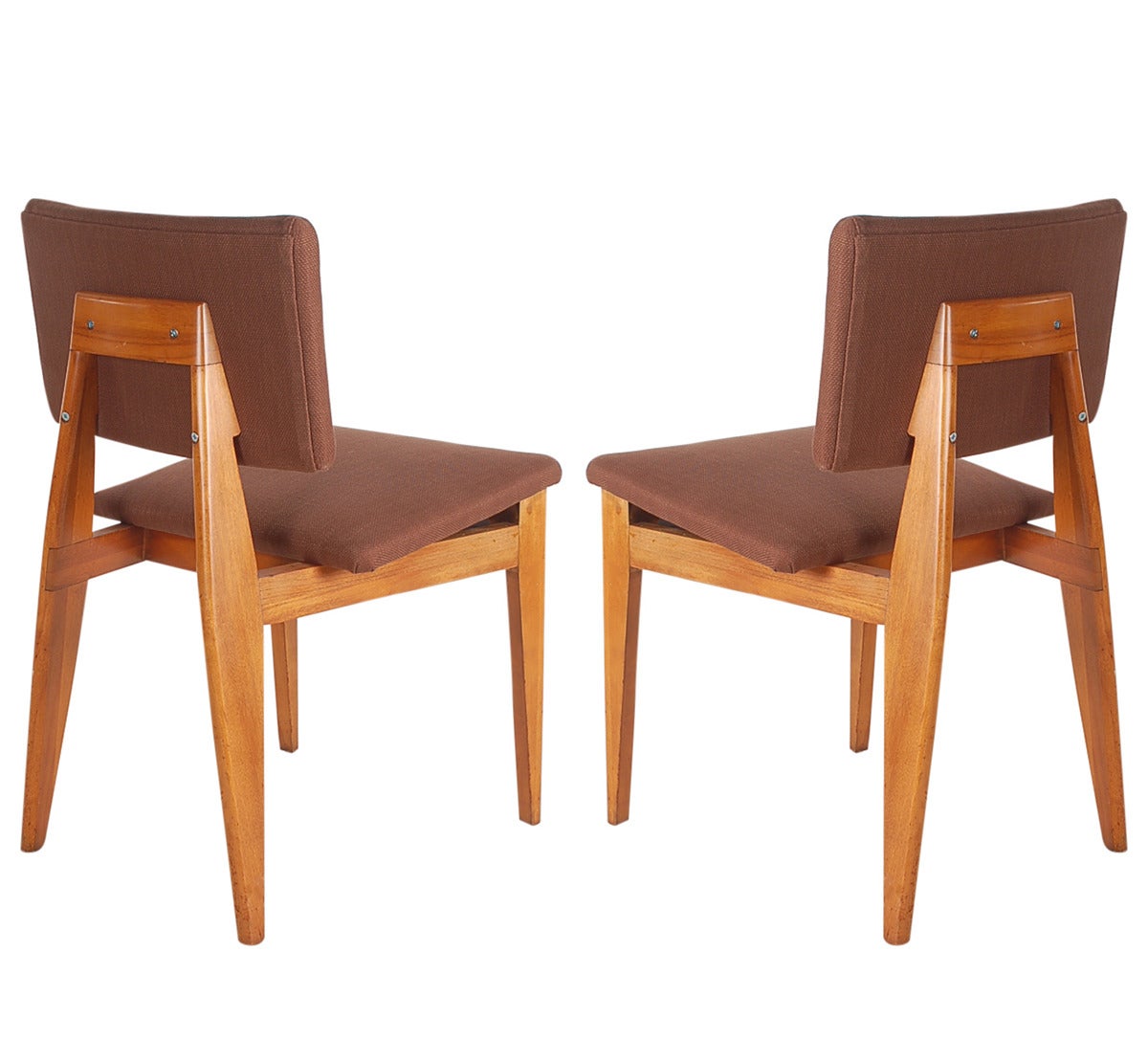 An incredible complete set of eight dining chairs designed by George Nelson for Herman Miller. They features solid maple chair frames with brand new brown tweed upholstery.