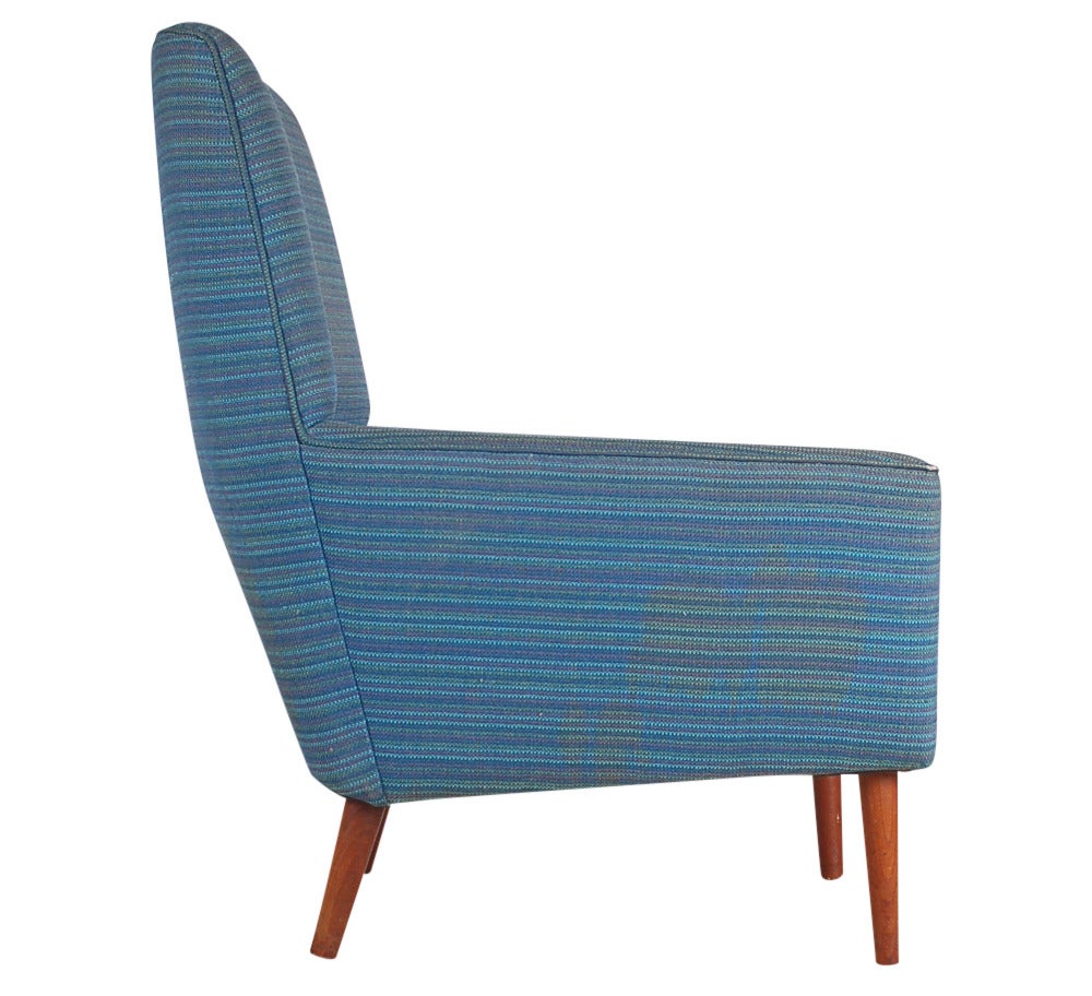 A matching pair of lounge chair made by Dux and probably designed by Folke Ohlsson. Provenance: copy of original receipt from 1967. Upholstery service is available for these chairs at $600 each (buyer supplies fabric)
