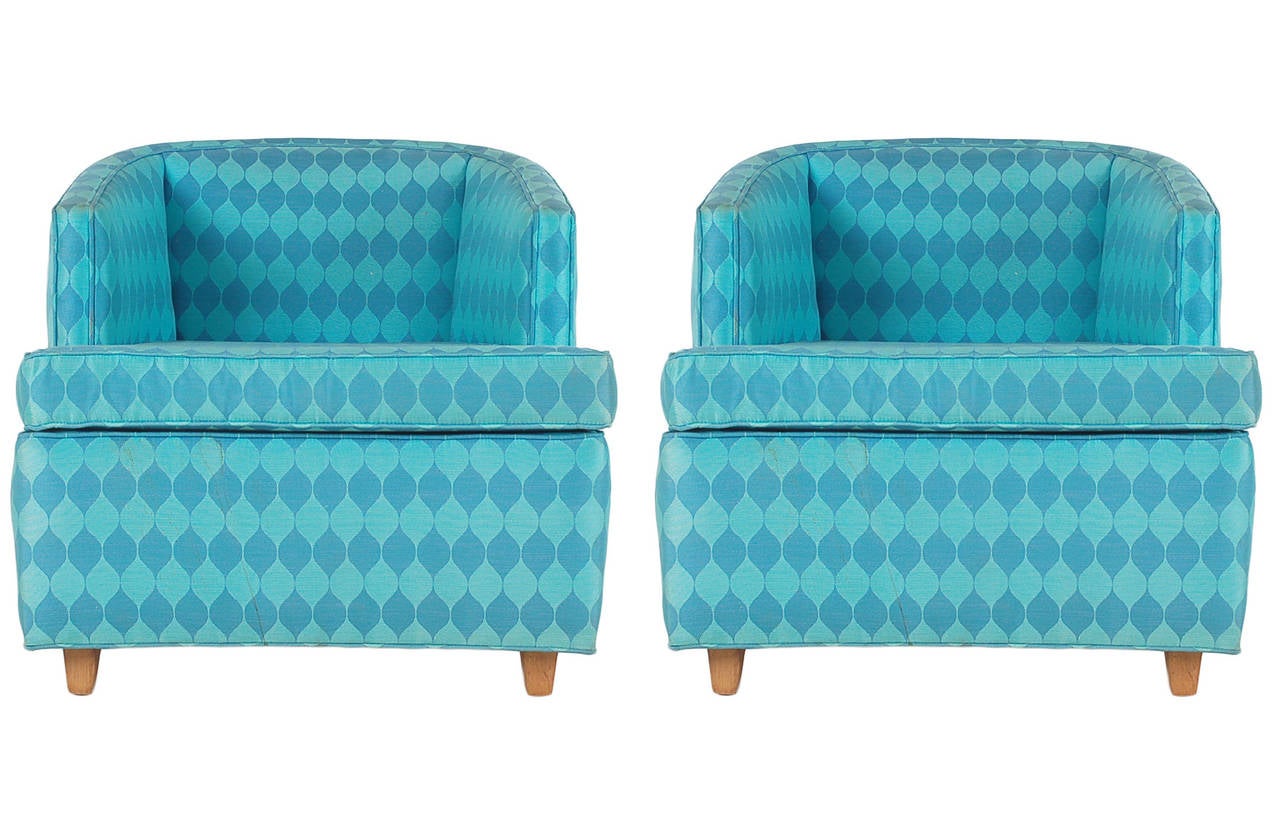 A great pair of club chairs from the late 1960s in the style of Edward Wormley. Upholstery has some light soiling and can be reupholstered at $600 per chair (buyer supplies fabric).