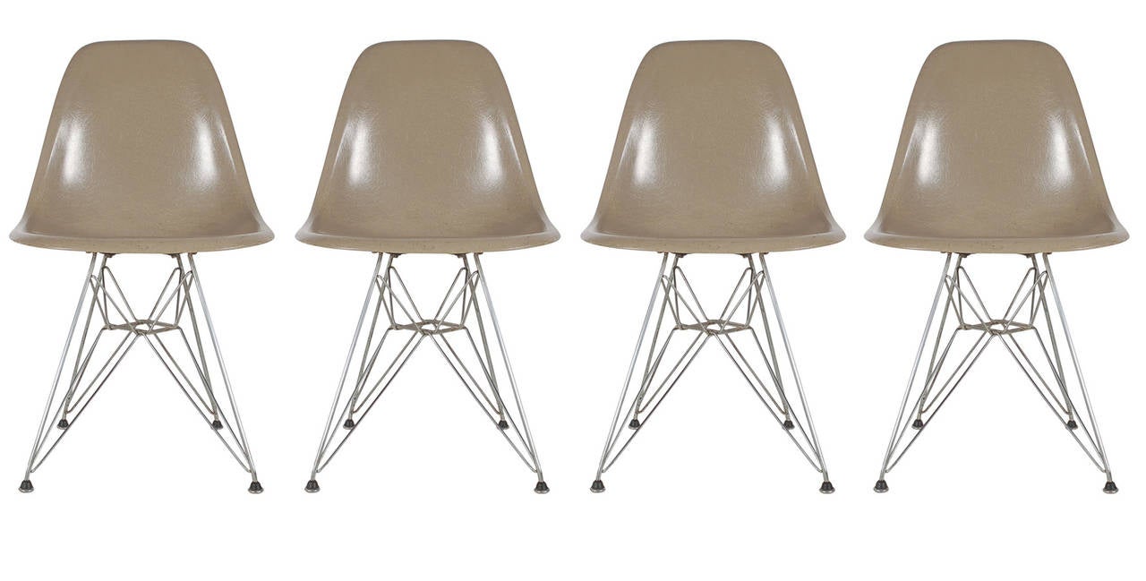 This five-piece group was purchased as a set in 1957. It features four greige colored fiberglass dining chairs, and a rarely seen large DTM in teak. All are marked with appropriate labels.