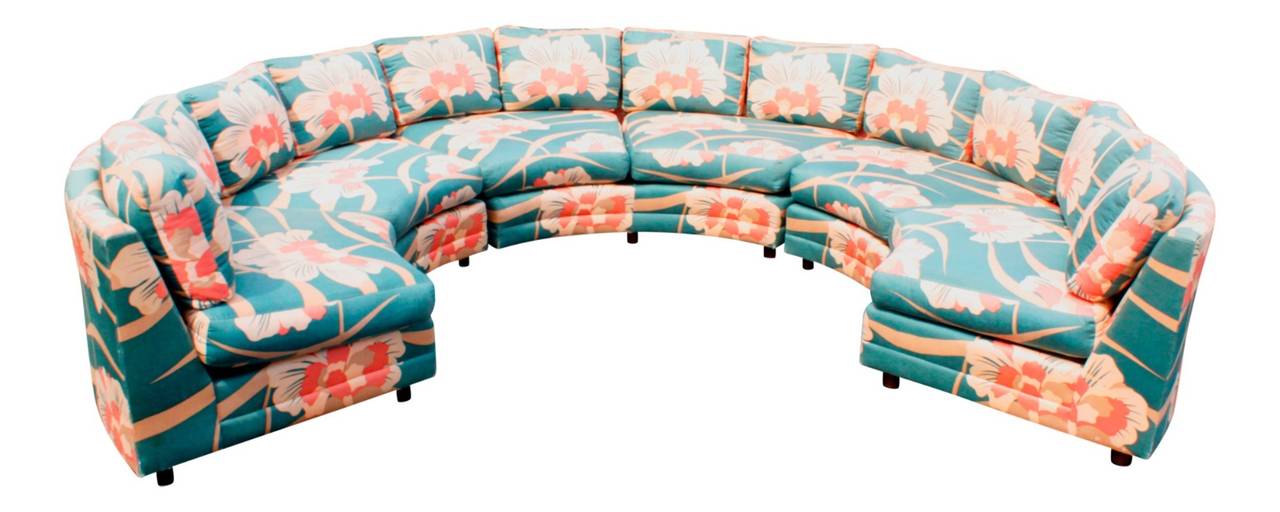 Clad in a bright deco-inspired cotton fabric, this sofa is quite the conversation piece! Sofa is sound and sturdy. Foam is soft. Upholstery does show wear to corners, spots and some fading. This sofa comes in three sections, each with two seat