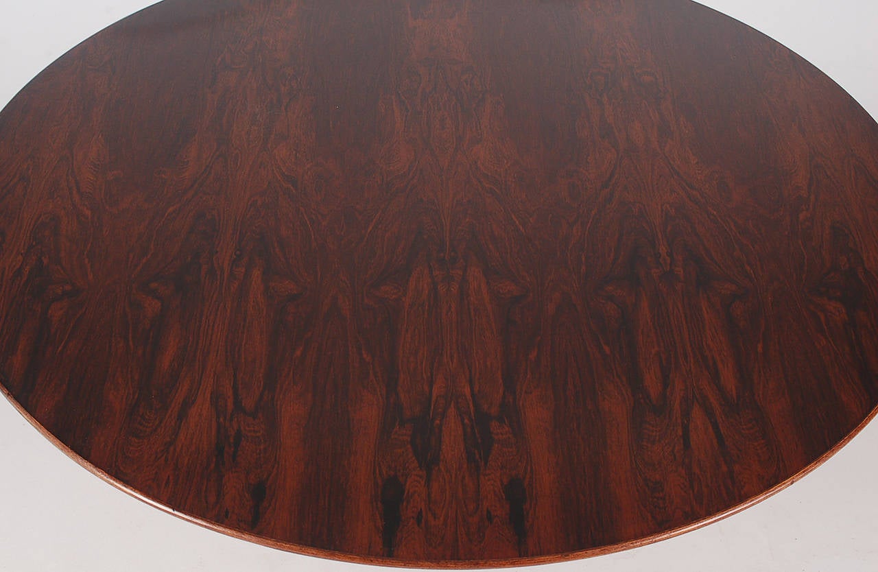 Early iconic cocktail table by famed American designer, Warren Platner. This table is increasingly difficult to find in rosewood, and this is a Fine example. The 42 inch round rosewood top retains its original label. The top shows minimal age; most