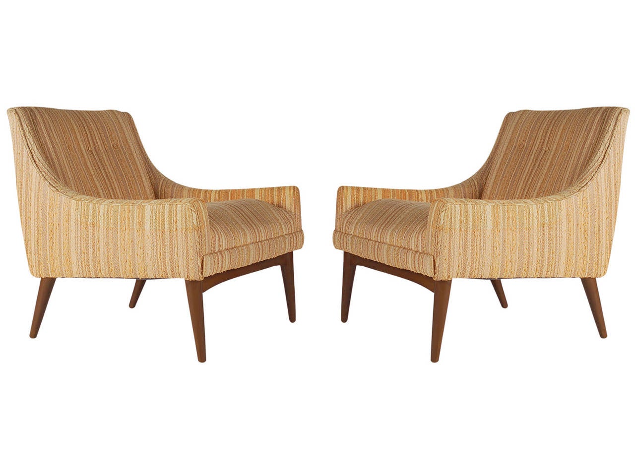 A lovely sculptural pair of lounge chairs in the style of Milo Baughman. The feature the original upholstery and tapered walnut legs. Upholstery is fair and needs recovering. 

In the style of: Edward Wormley, Paul McCobb, Thayer Coggin, Dunbar