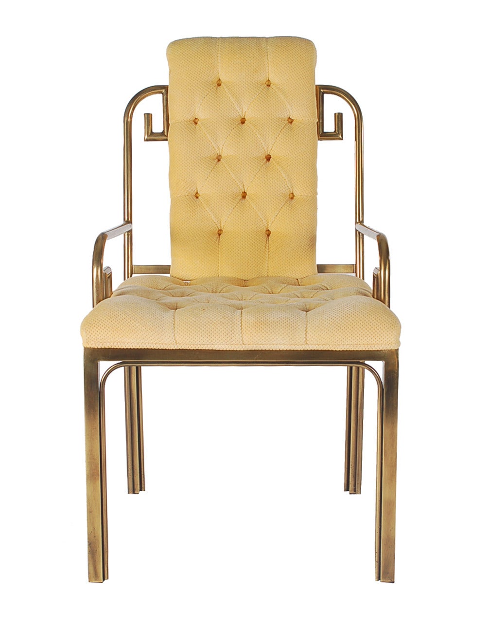 A decorative tufted armchair produced by Mastercraft. It features heavy solid warm patinated brass framing with original upholstery. 

In the style of: Maison Jansen, Karl Springer, James Mont, Bernard Rohne.