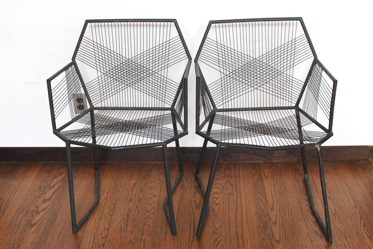 Unique, vintage hand-welded tubular metal armchairs with black finish. Excellent geometric design. Each chair is sturdy, comfortable and unique due to handmade nature. Old welded repairs present, please see photos. Provenance and age unknown.