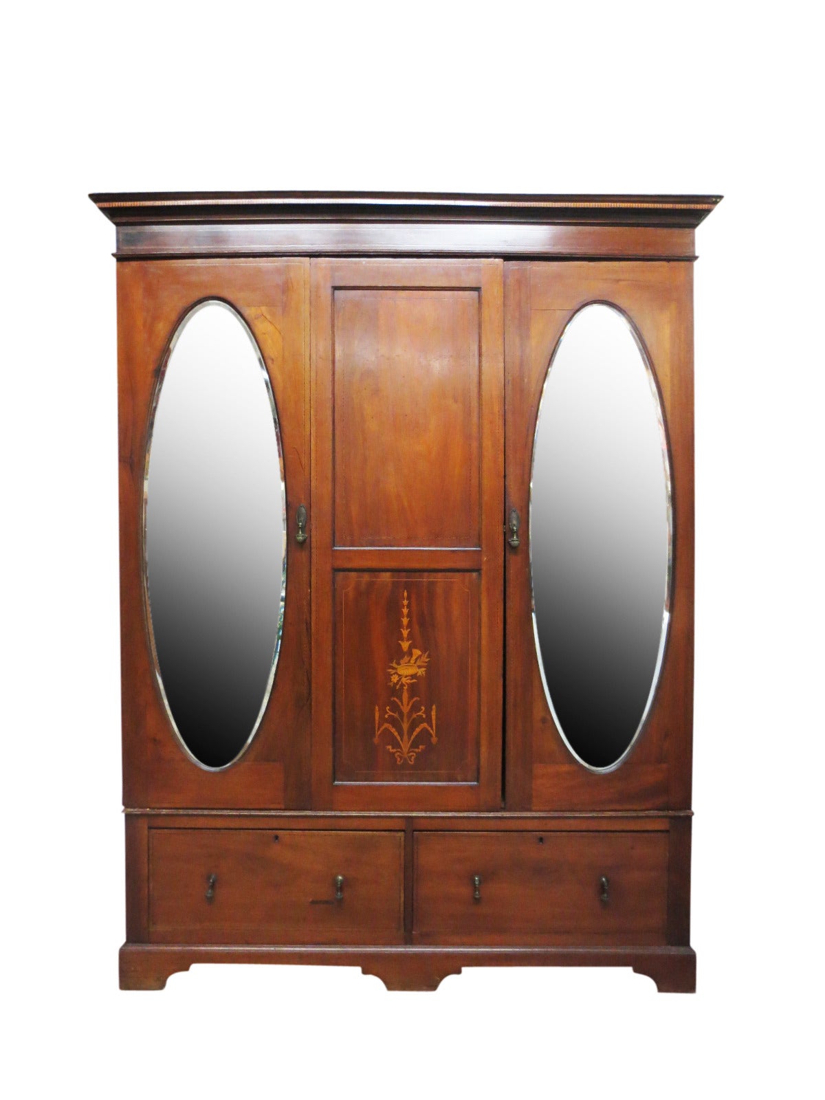 Collapsible armoire with two oval-mirrored doors. The armoire dismantles into four pieces for easy transport and assembly. Scratches at edges, scratches and dents on sides.