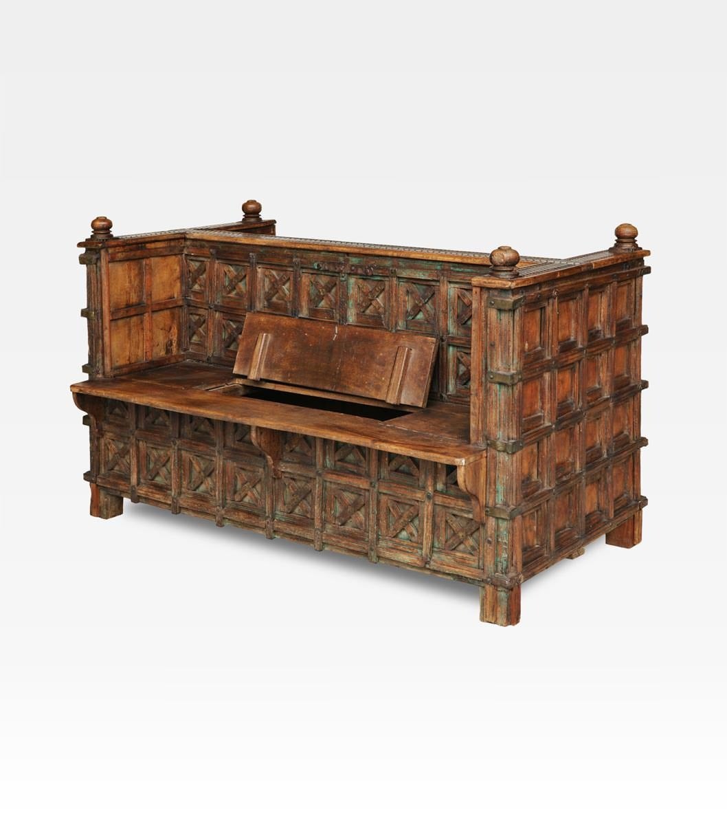 Double bench made of precious teak wood. The work-craft is typical of Mughal period, the indian gold age. Beautiful and also functional under the double seat there are two wide compartment.  A older indian version of European benches lovers. Perfect