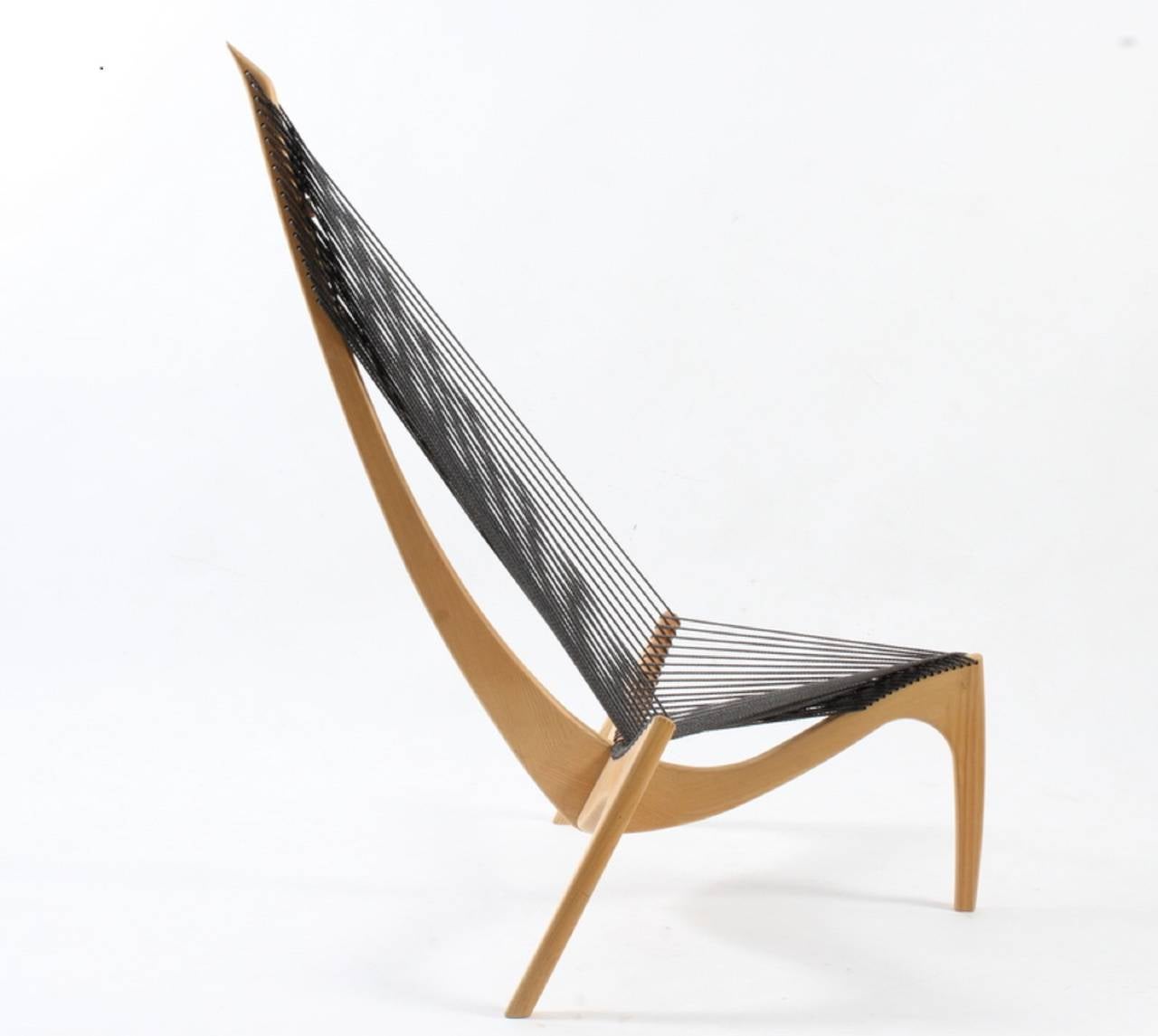The harp chair by Jorgen Hovelskov in solid ashe with the original flag halyard rope. Much more comfortable than it looks! Manufactured by Jorgen Christensen Snedkerri.