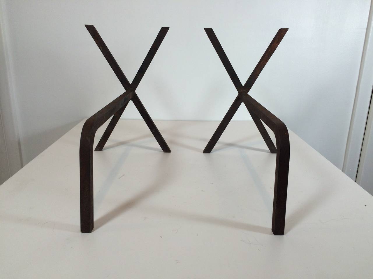 Simple and practical in form, these angular andirons were produced by George Nelson. 5/8