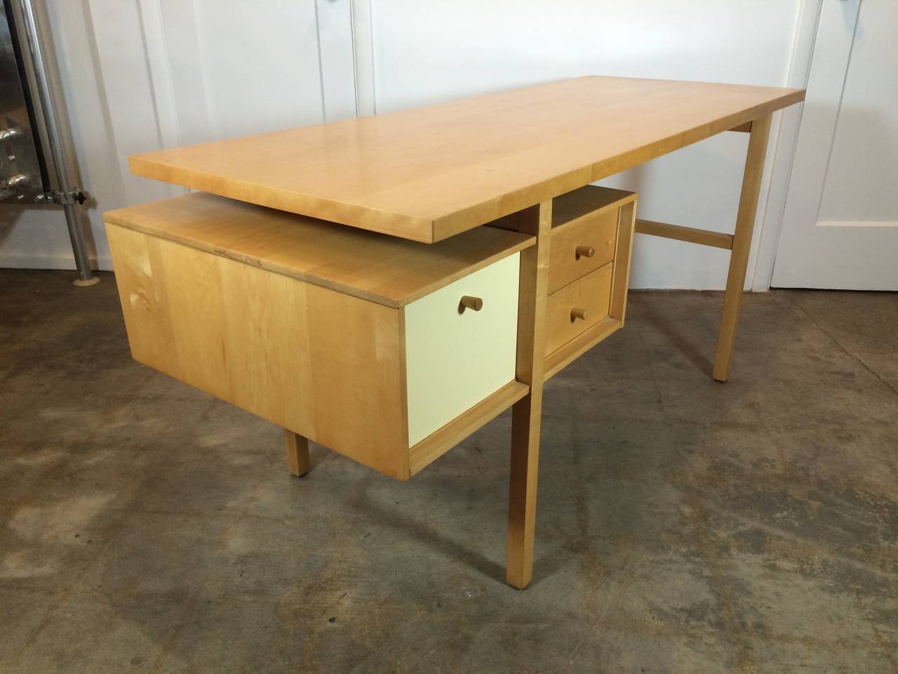 A RARE DESK, MODEL NO. 3116
Designed by Milo Baughman and manufactured by Murray Furniture company, Winchendon, MA. The original tag resides in the upper right drawer of the desk. Baughman designed the interior and exterior of his family home, his