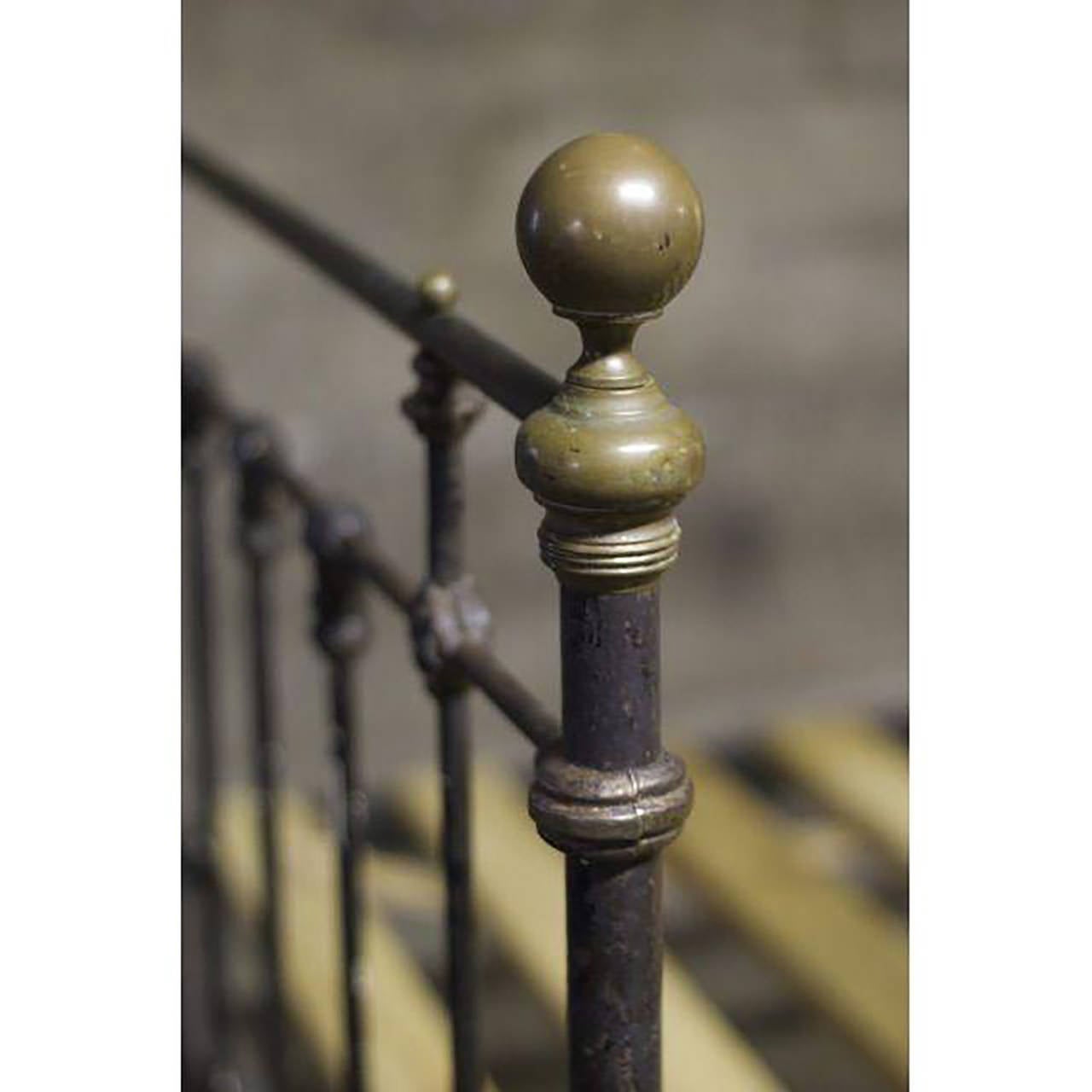 A nicely distressed 19th century cast iron and brass bed frame with brass finials on all four posts. The bed has decorative brass detailing throughout and a solid frame. It has new custom pine and cloth slats and fits a double mattress.
Very