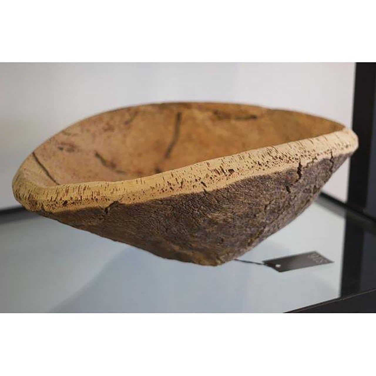 An organic cork burl bowl. This bowl was created from harvesting the burl after 9 years of growth on a cork tree. 
22.0ʺW × 15.0ʺD × 7.0ʺH