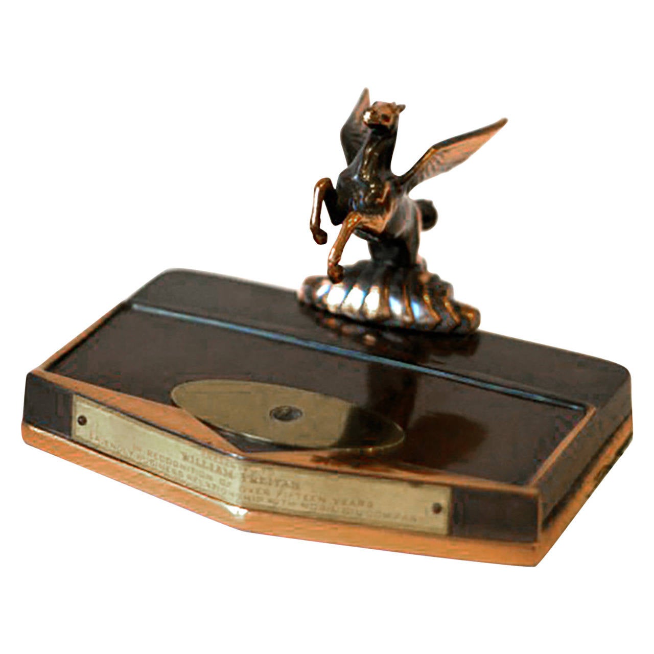 Copper plated Pegasus pen holder with plaque dedication to a business associate of Mobile Oil Company. Circa 1930s.

H:4