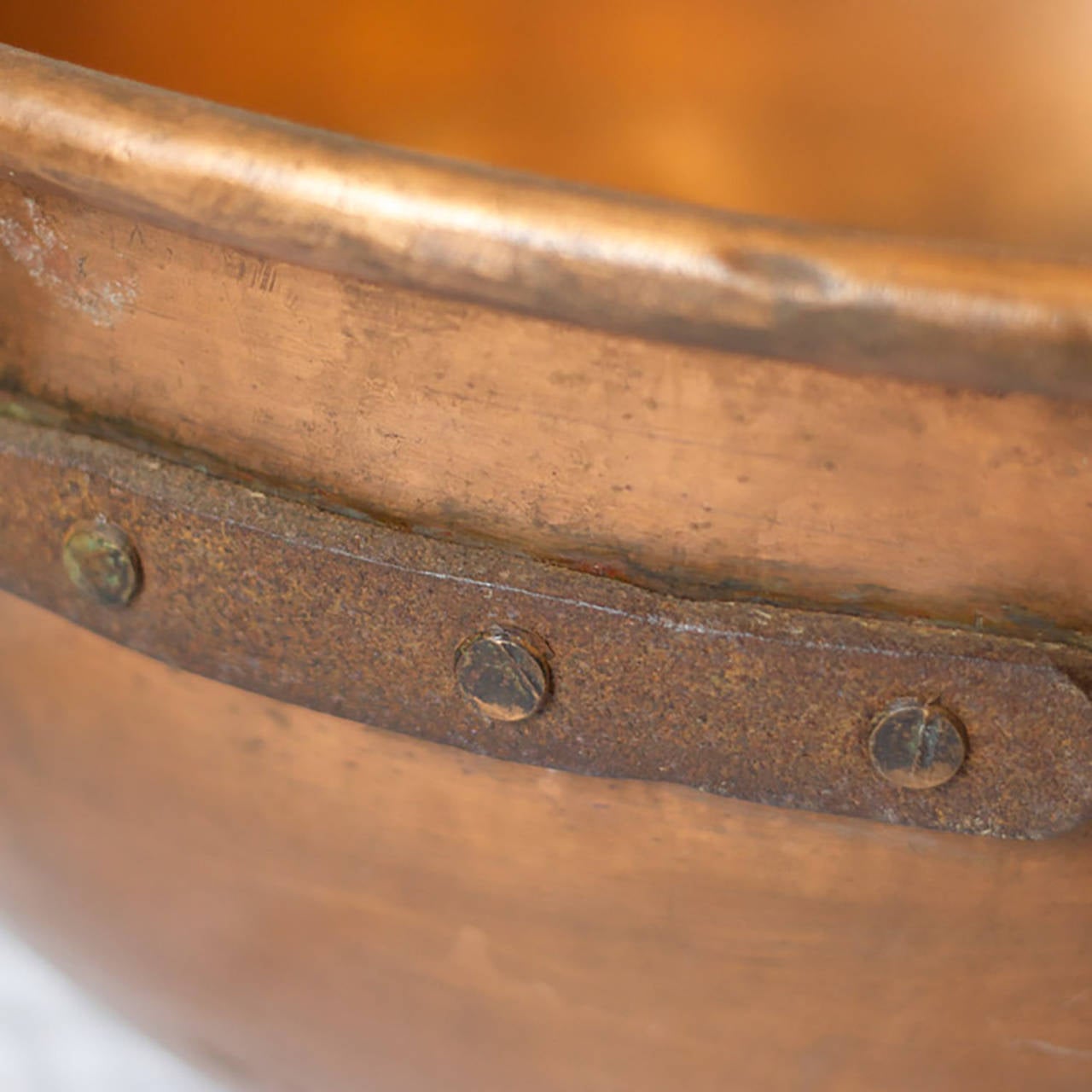 Large antique American solid 100% copper candy bowl with cast iron handles. Used to make pulled taffy. 
Circa 1890s. 
Excellent condition. 
Dimensions of the Pot: Dia.: 26.5