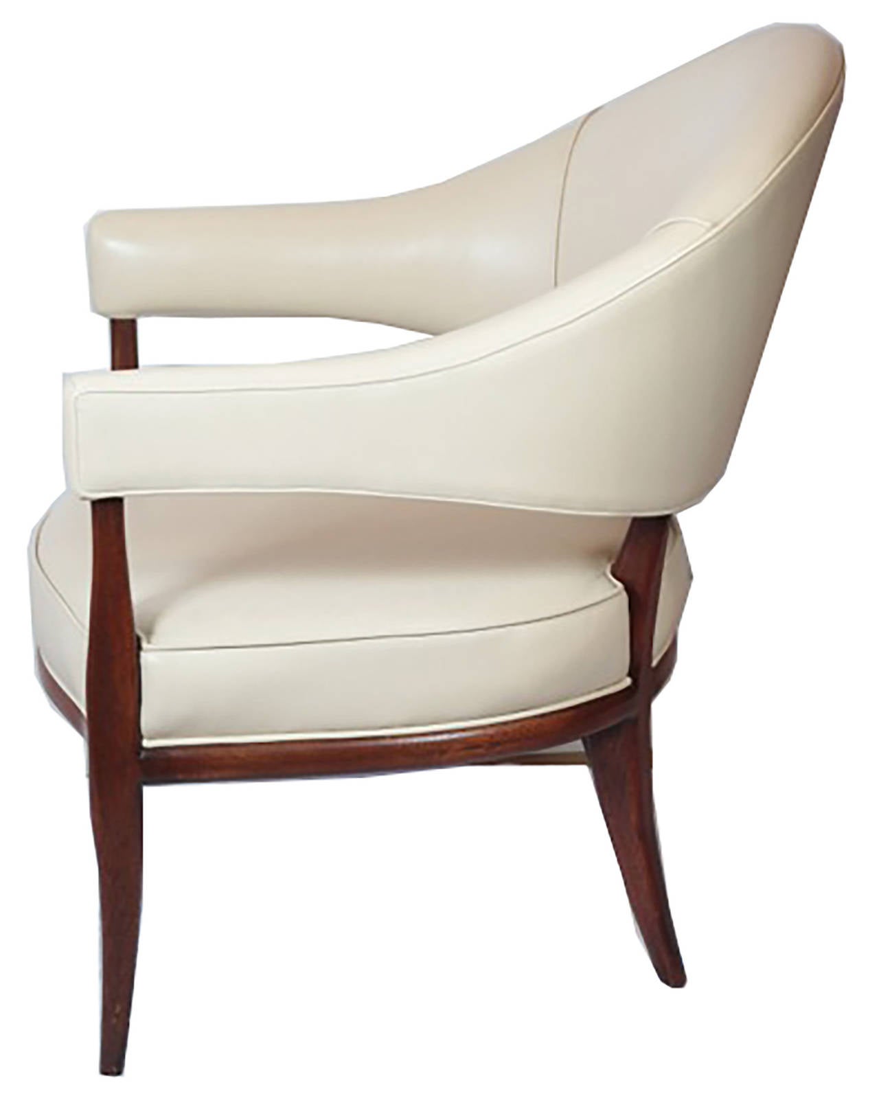 Morrow Occasional Chair by Michael Berman Limited
Barrel back arm chair with rounded, shaped legs extending from the bottom of the arms and back to the floor. Tight seat cushion is framed with exposed wood base. Shown in cream leather