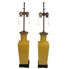 Pair of Chinese Yellow Shouldered Ceramic Lamps on Wood Bases