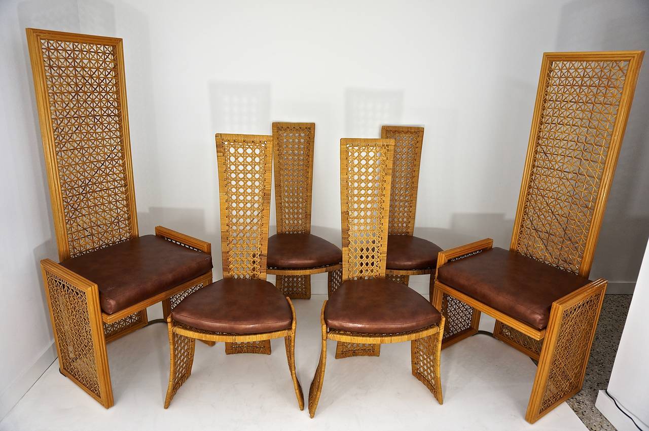 A stunning set of eight Italian rattan dining chairs by Vivai del Sud, Rome, Italy.

Sold by Casa Bella in the 1980s.

Very good large-scale French caning vinyl zippered seat cushions in a mottled copper color.

Two head chairs and six side