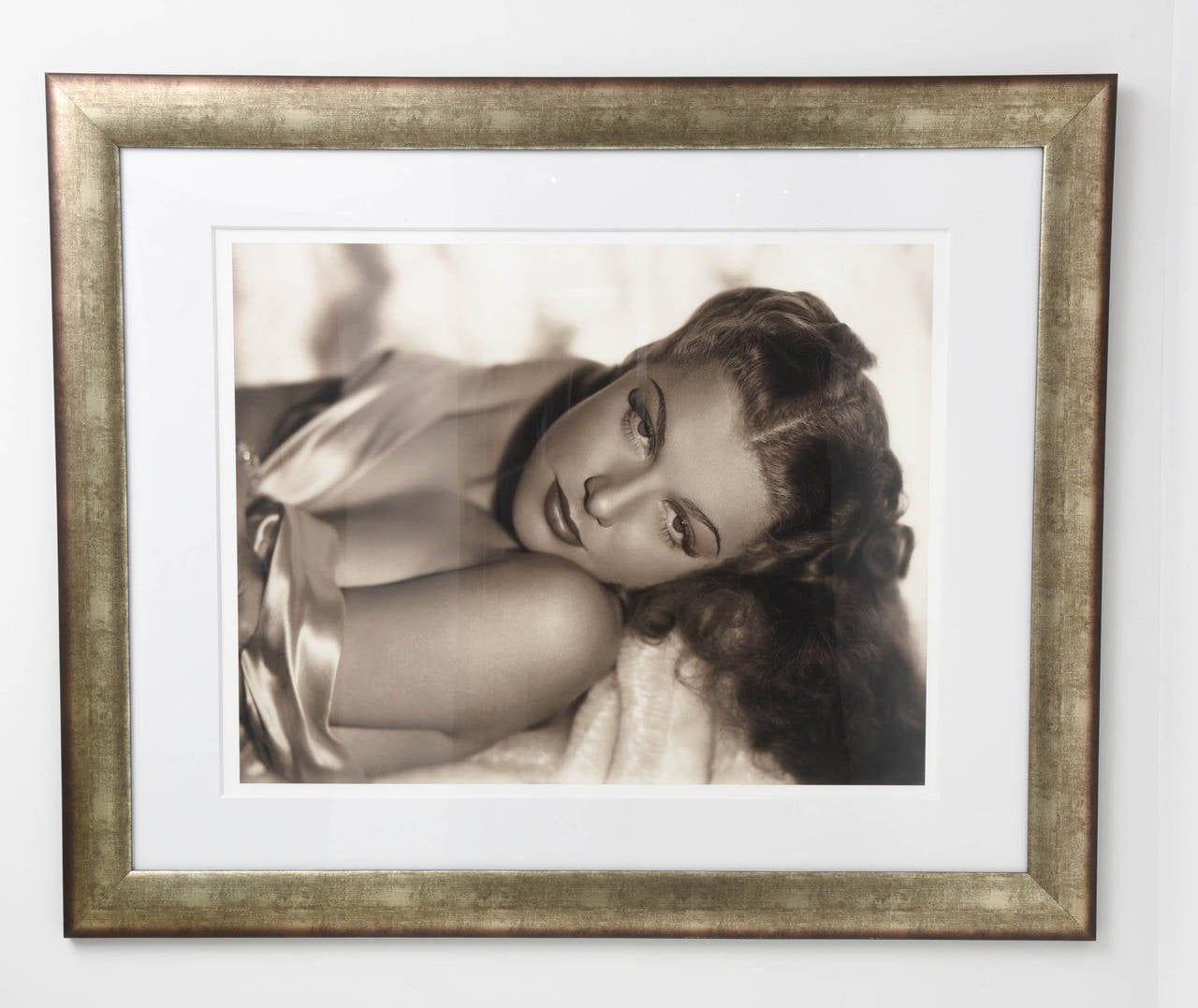 This iconic photograph of the Hollywood actress Ann Sheridan was originally taken in the 1930's by George Hurrell the glamour portraitist, whose mesmerizing photographs filled the pages of Vogue and Vanity Fair, also worked as the head of the MGM