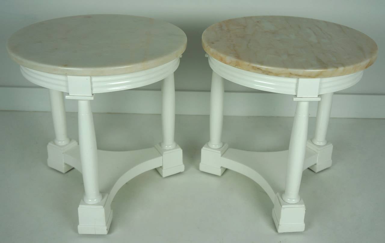 Beautiful pair of Hollywood Regency side tables in white lacquer finish with polished marble tops.

Please feel free to contact us for a shipping quote, or other questions and information by clicking 
