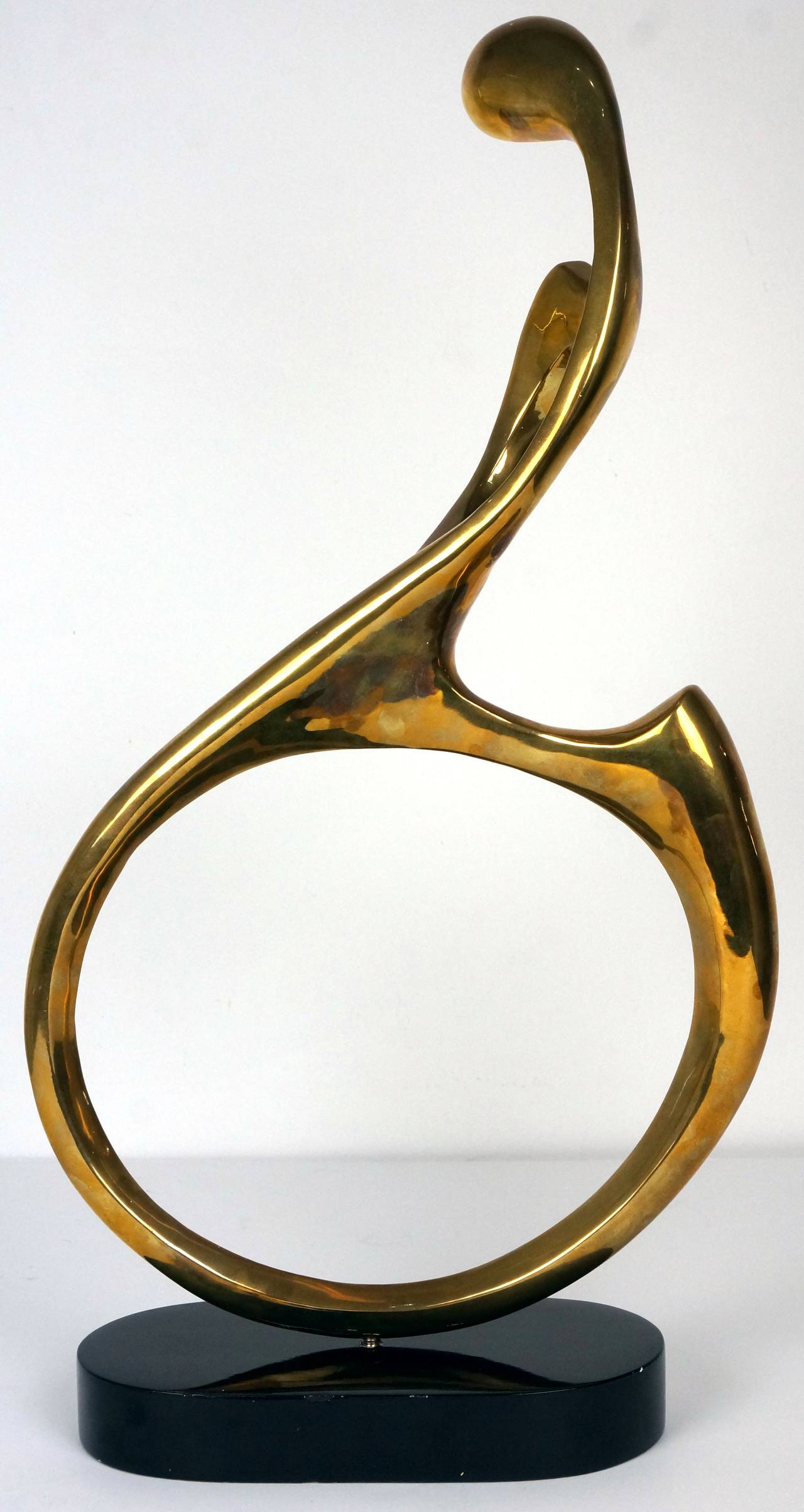 This bronze sculpture from Surawongse, Thailand, was sand-cast and hand polished to achieve its amazing form and finish.

The piece depicts the female form in a biomorphic fluidity which evokes a sensuality and gracefulness. 

The piece has an