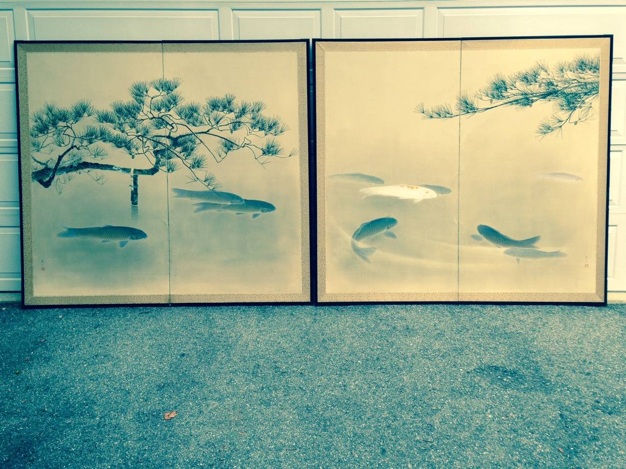 Japan, a pair of two panel screens byobu depicting Koi, ink and mineral colors on paper, each screen 168cm, 67.5” high and 187cm, 75” wide, Taisho to early Showa period, (1920’s-1930’s)

The bi-folded screens featuring prize multi-colored koi