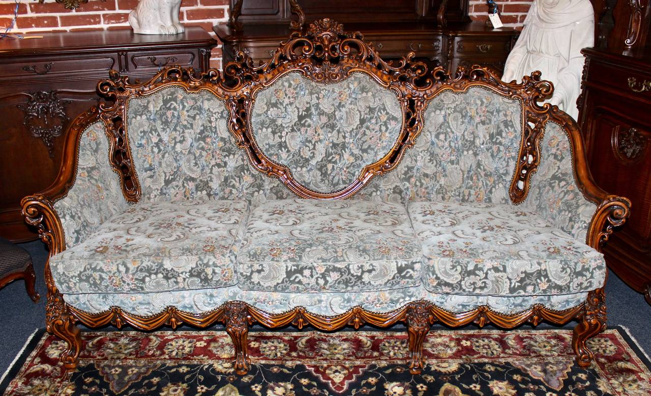 This alluring, French parlor set is made in the Rococo style. Includes a 